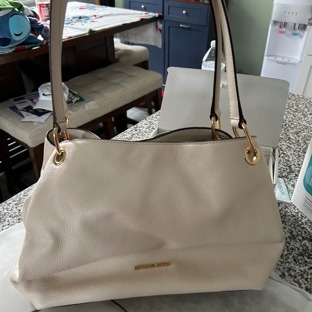 New without tags Michael Kors cream hobo bag.